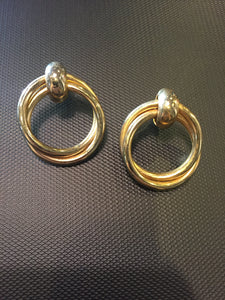 Intertwined gold doorknocker earrings